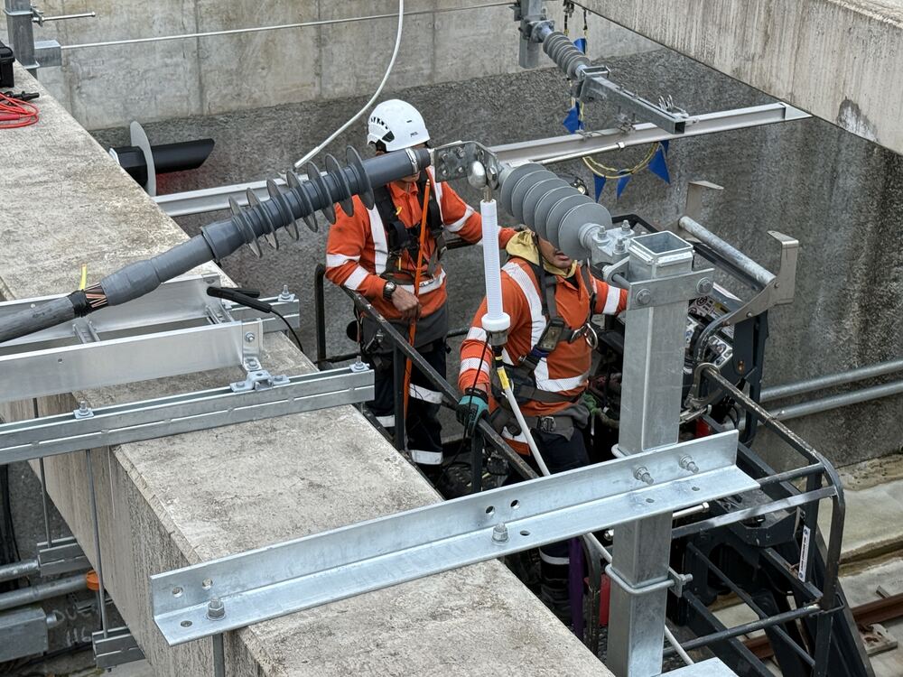 Technicians terminating 11kV cable in a substation cable pit